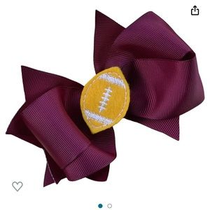 Football hair clip new in bag